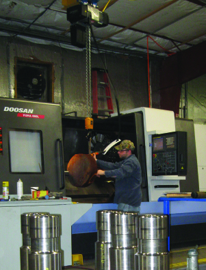 This lathe machines the company’s larger rock-drilling bits, including some that went into drills sent to rescue the miners in Chile.