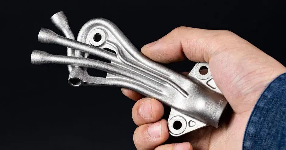 hand holding a dmp manifold fluid flow optimization image alt