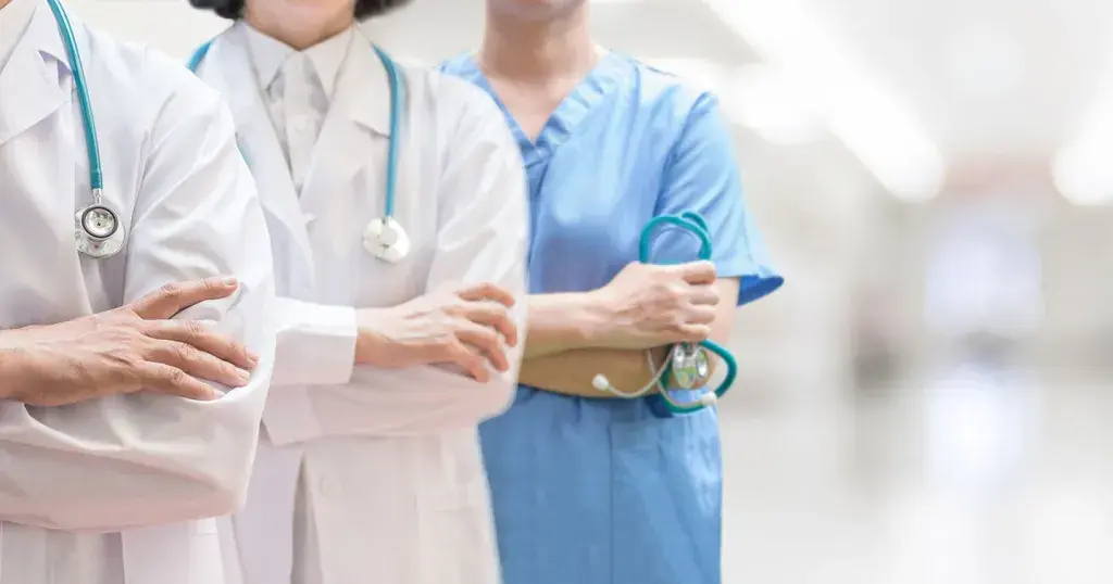 a group of doctors standing together in a row