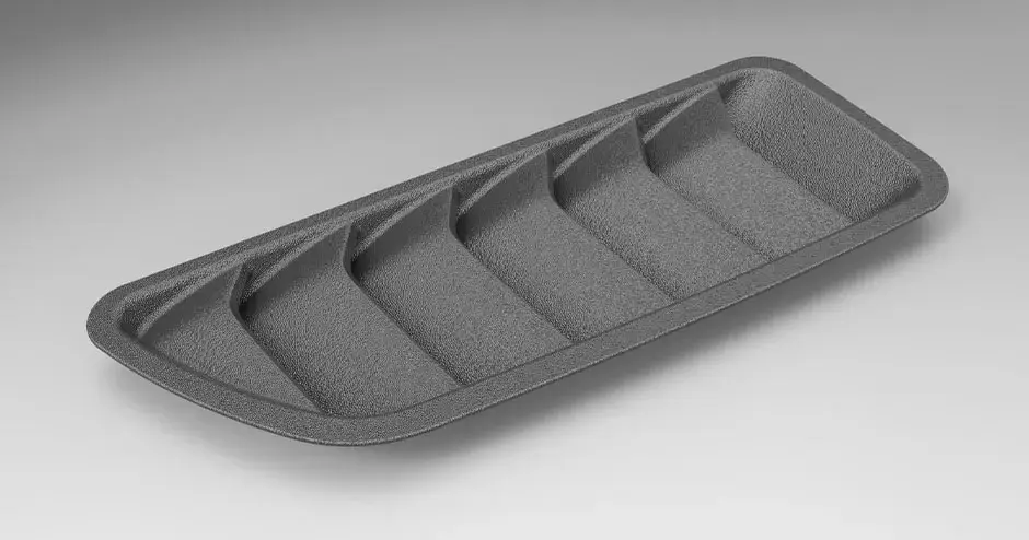 Uma grade de "tubarão" plástica impressa em 3D com qualidade de grau de produção e acabamento de superfície texturizado.