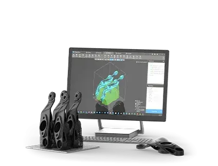 A desktop computer next to a 3D printed part, as shown on the desktop
