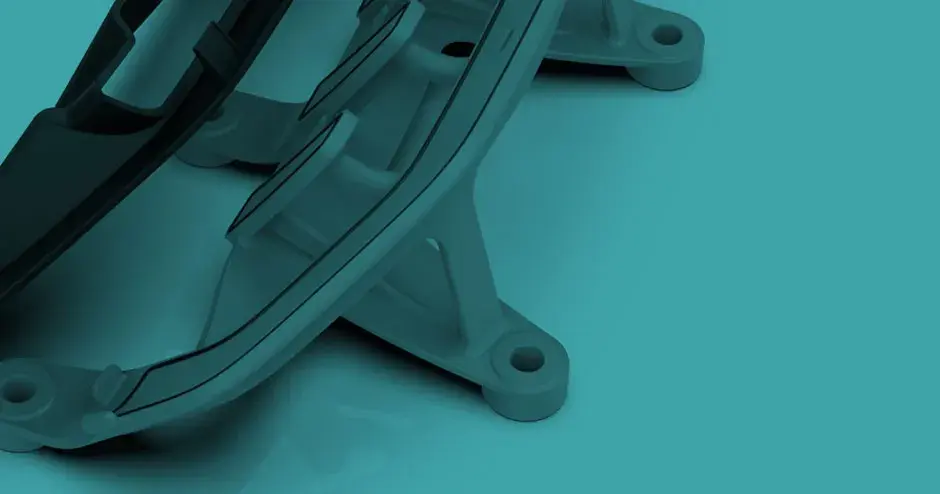 Fixação de produção que usa um vácuo para segurar e instalar peças de veículos sem marcar superfícies.